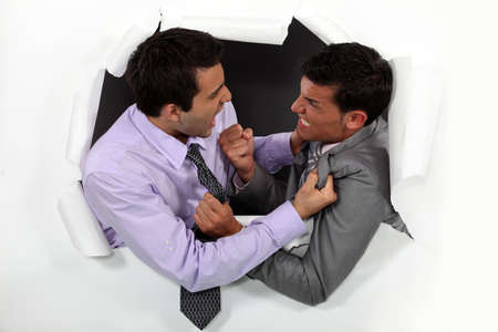 Young businessmen arguingの写真素材