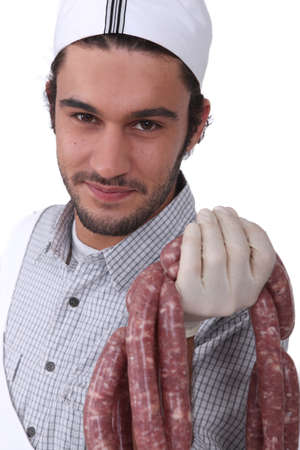 butcher with sausagesの写真素材