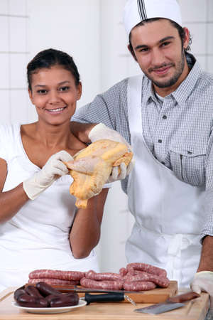 a butcher and his wife assistantの写真素材