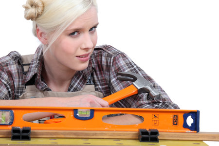 blonde holding a hammer