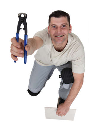 Man holding pair of clippersの写真素材