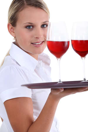 Waitress with tray and glassesの写真素材