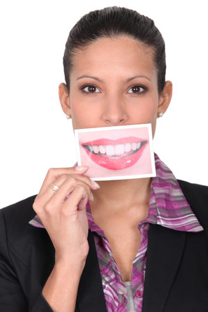 Woman holding card with smile