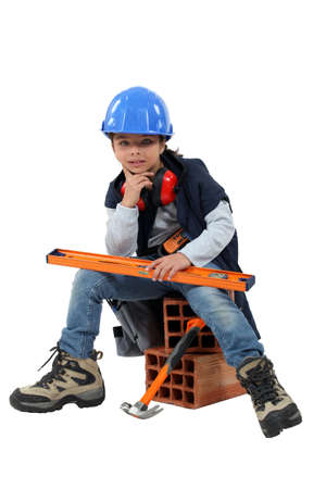 Child dressed as a builderの写真素材