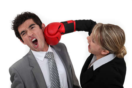 Woman punching her colleagueの写真素材