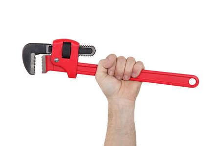 A hand holding a wrench の写真素材