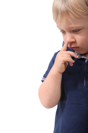 Little boy picking his noseの写真素材