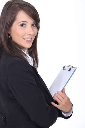 Young woman holding notepadの写真素材