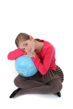 Girl hugging a globeの写真素材