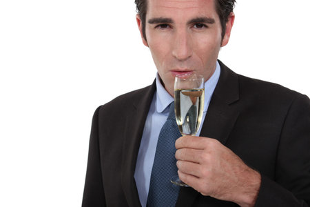 Smart man drinking champagneの写真素材