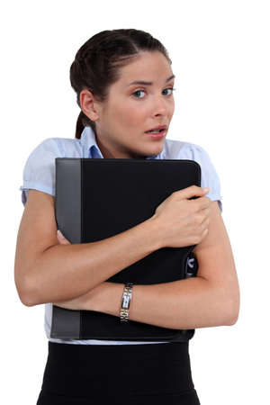 Worried woman holding folderの写真素材