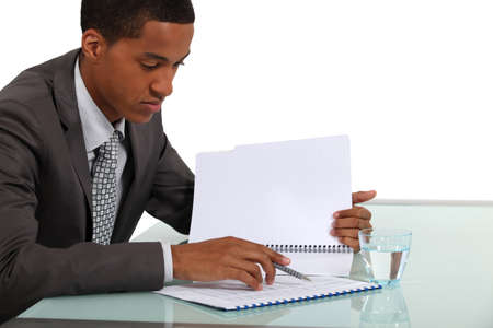 Businessman reviewing a reportの写真素材