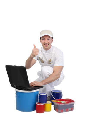 Painter with a laptopの写真素材