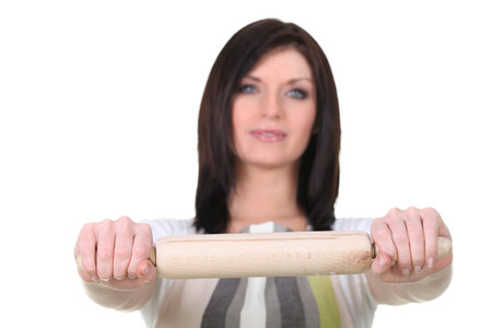 a female cook showing a rolling pineの写真素材