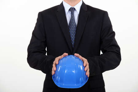 Architect holding his hard hatの写真素材