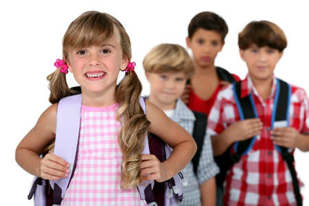 kids wearing their school bagsの写真素材