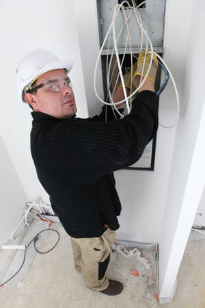 Electrician fitting house electricsの写真素材