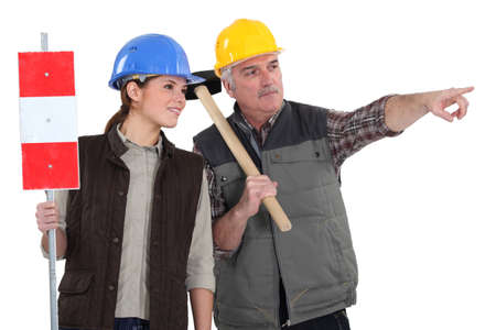 Male and female road workersの写真素材