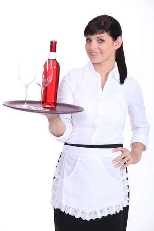 Young waitress on white backgroundの写真素材