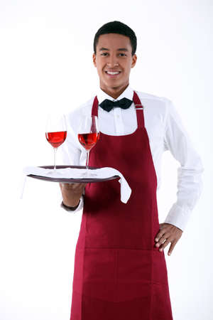 wine waiter serving two glasses of wineの写真素材