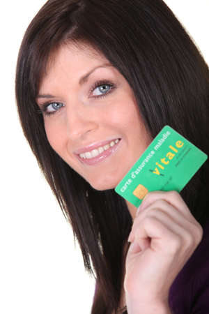 Woman showing her health cardの写真素材