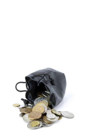 Coins spilling from purseの写真素材