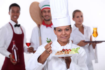 female chef presenting a plateの写真素材