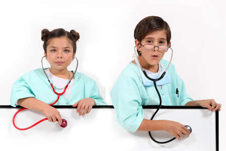 Children dressed as doctorsの写真素材