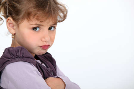 A little girl pouting の写真素材