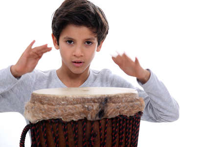schoolboy with jumbo drumの写真素材