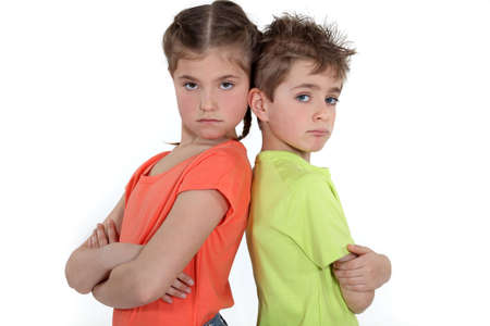 Children standing with arms foldedの写真素材