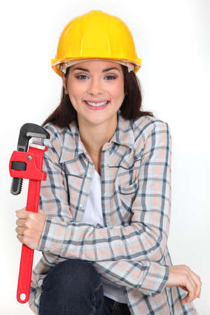 Woman holding adjustable wrenchの写真素材
