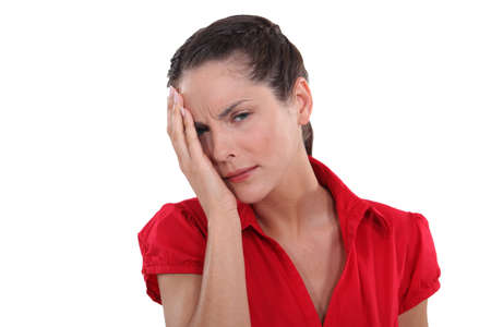 young woman having ocular painの写真素材