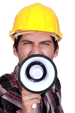 A construction worker calling a strike の写真素材