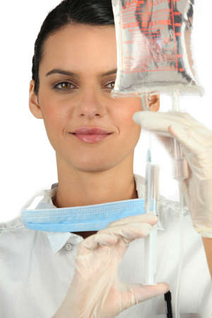 Hospital nurse with a drip bagの写真素材