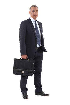 Full length businessman with a briefcaseの写真素材