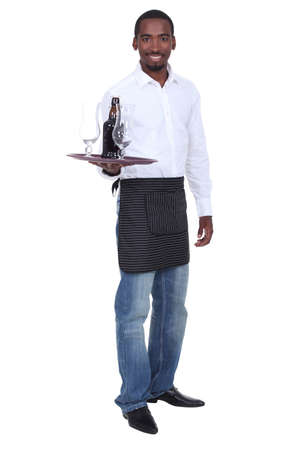 Portrait of a waiter with his trayの写真素材