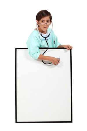 Child dressed up as a doctorの写真素材