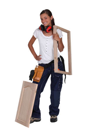 Girl with picture frame on shoulderの写真素材