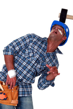 Injured man smashed by hammerの写真素材