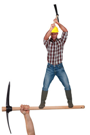 Man wielding pick-axe