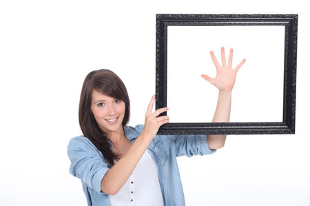 Young brunette with picture frame