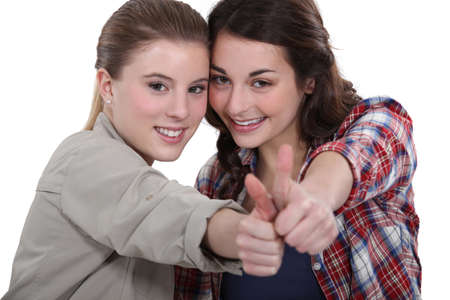 Young women giving the thumb's upの写真素材