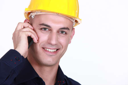 Worker with a cellphoneの写真素材