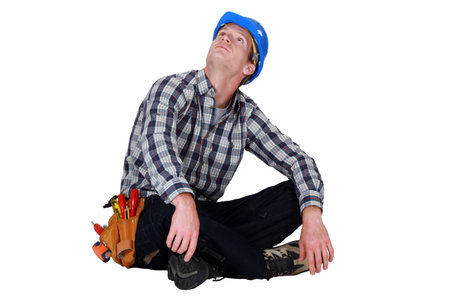 craftsman sitting on the floor cross-legged