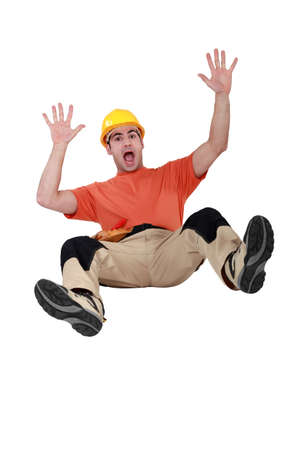 Tradesman falling backwardsの写真素材