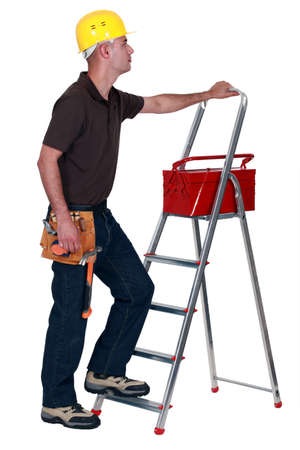 Man with a toolbox and stepladderの写真素材