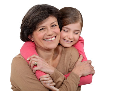 Young girl hugging her grandmother