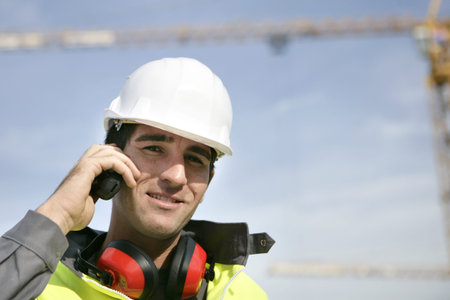 Foreman stood with crane in the background