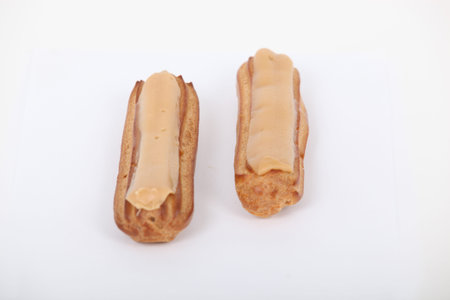 Two cream eclairs
